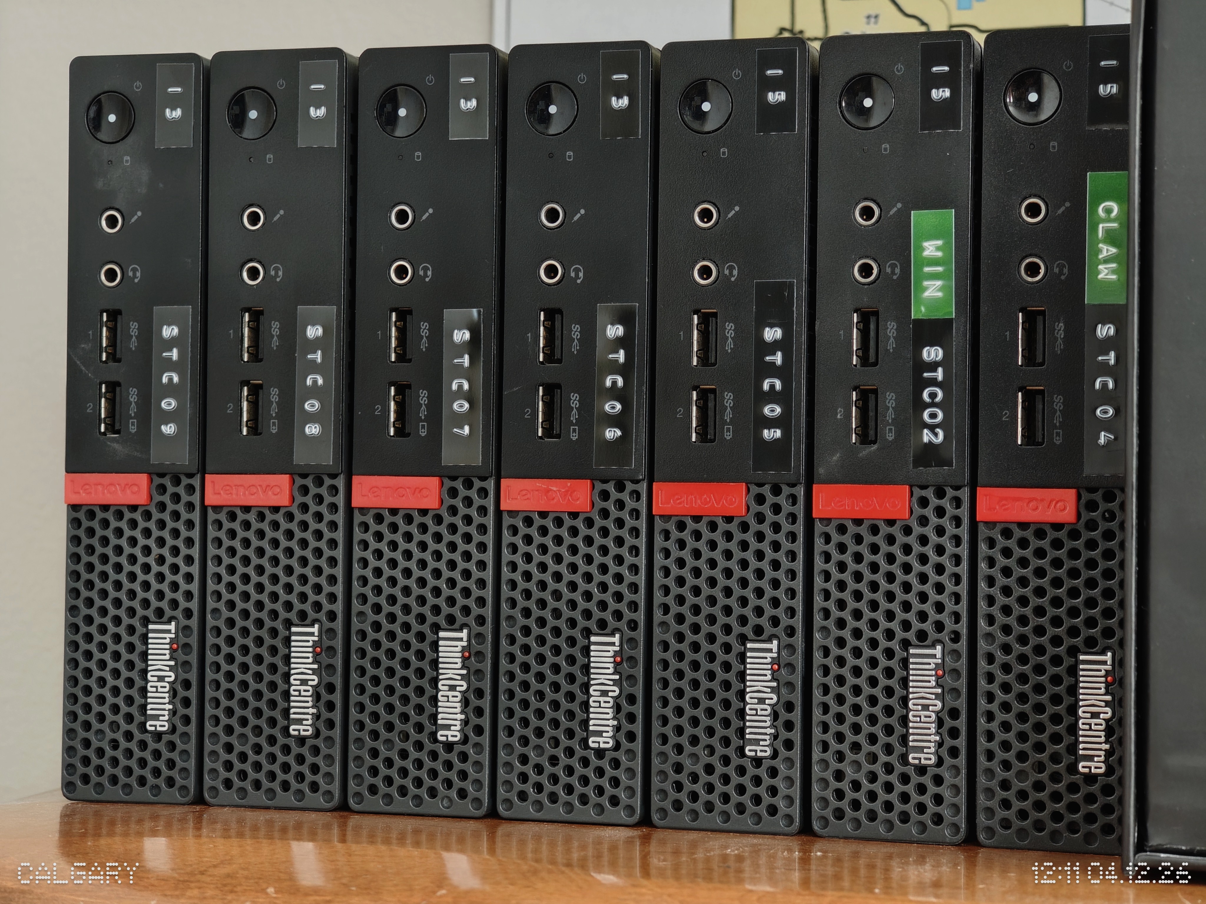 A shelf of reliable ThinkCentre “Tiny”-class computers